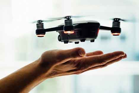 drone floating above person's hand 