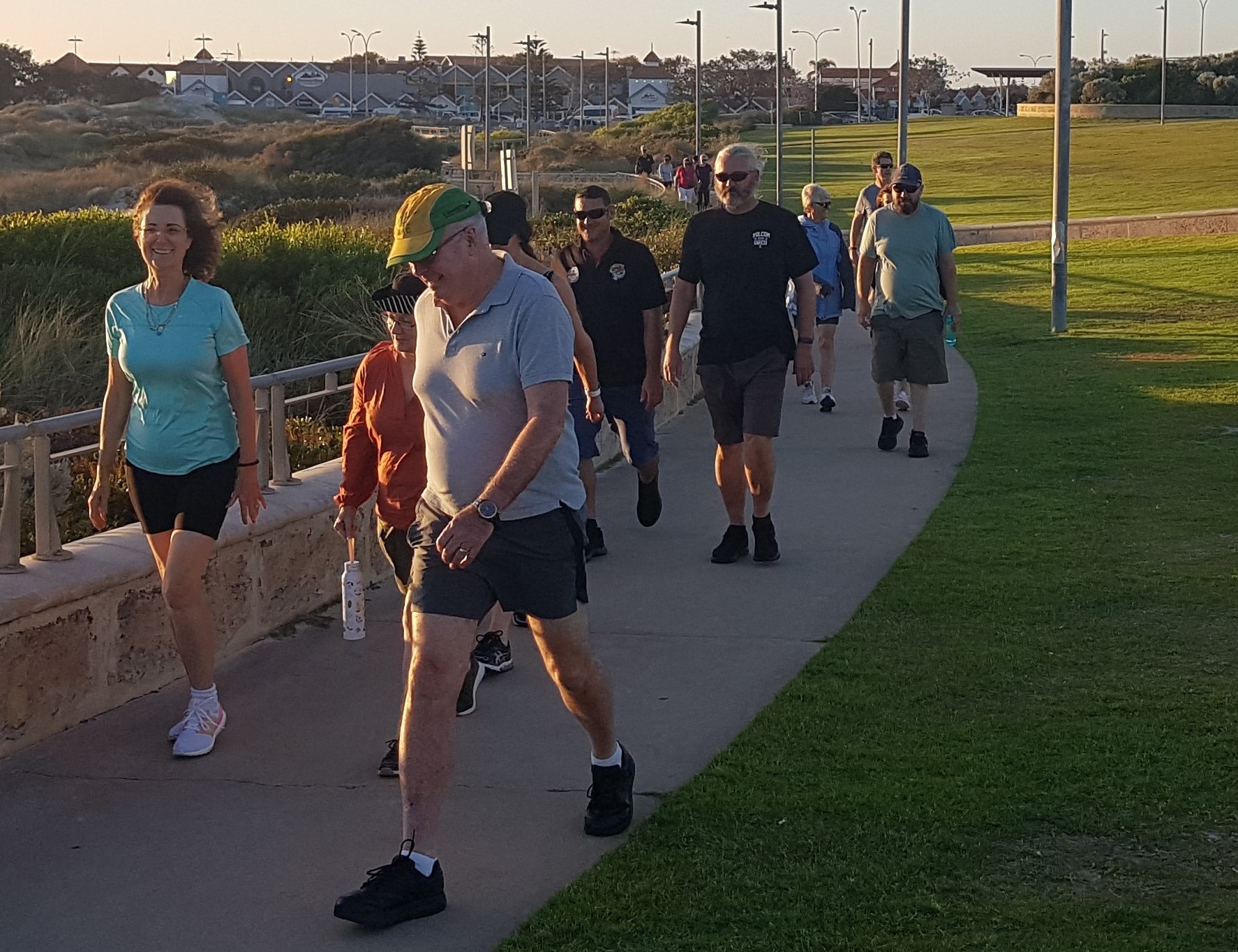 Group of people walking on a path. 