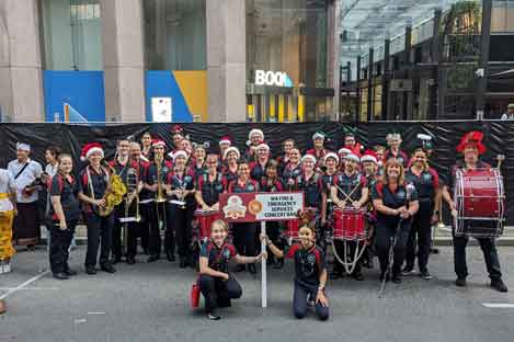 group of people holding various musical instruments 