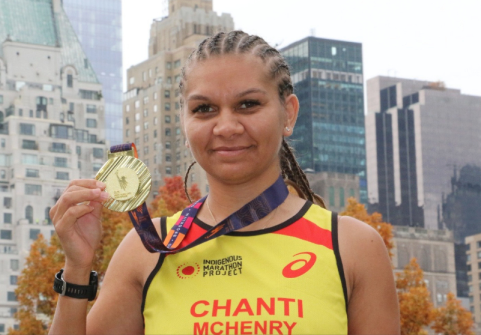 Girl holding a gold medal