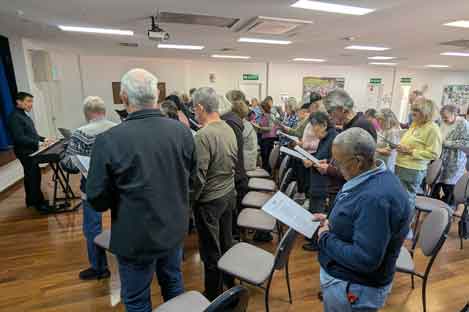 people standing and singing